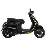 Black scooter with green accents on a white background