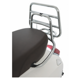 Vespa Original Chromed Rear Luggage Rack for the Primavera and Sprint  A must-have Vespa accessory. The chromed rear luggage rack has always been a firm favourite among Vespa customers who want a unique and original accessory. The practical fold-down shelf offers excellent carrying capacity.  cod. 1B000789