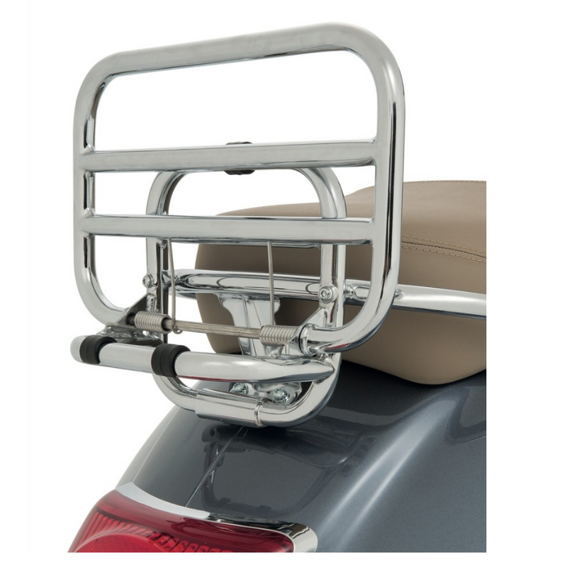 Vespa Original Chromed Rear Luggage Rack for the GTS Range  A must-have Vespa accessory. The chromed rear luggage rack has always been a firm favourite among Vespa customers who want a unique and original accessory. The practical fold-down shelf offers excellent carry capacity  Cod. 605665M